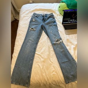 24 inch waist, dark blue, rips in knees